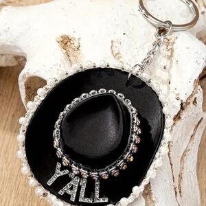 Black and Silver Keychain with Hat Design